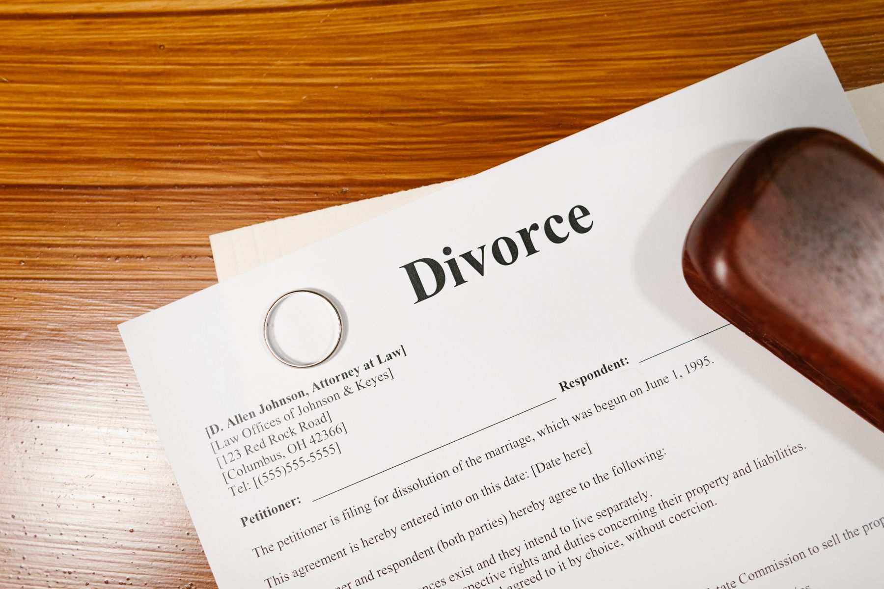 Divorce papers and a ring on a table